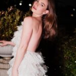 Lily James Instagram - Magical time in Rome with Finalmente l’Alba. 🇮🇹 Thank you so much @maisonvalentino for the most stunning gown for the premiere 🤍 Photos in the dark in Rome in Valentino by @clementina.dirobilant were captured in minutes before rushing to the film. Grazie millie! Rome, Italy
