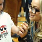 Liv Morgan Instagram - What a morning 🥹 Today on International Women’s Day, we got to honor one of our Community Champions, @flyfwd_athletics on the road to WrestleMania 🤩 Being a female in sports changed and shaped my whole entire life. Today we got to donate 3 thousand sports bras to the beautiful young women of Philadelphia to ensure that they have the ability and resources to participate & stay in sports. Thank you @frankfordhs for having us 🙏 Sending all my love to all my new besties 😉