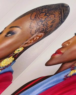 Lupita Nyong'o Instagram - THE STORY OF MY HEAD: 
I met @hennabysabeen last year at a wedding in Pakistan. She did the #HennaDesign for the bride and I was ASTOUNDED by the INTRICACY and BEAUTY of her work. There was something unique about the way she expressed herself in henna art. And I promised myself, "One day I will have a reason to work with Sabeen."
:
1.5 years later, when I got the invitation to attend the opening night of my dear friend, Mira Nair's @monsoonmusical, I was scrambling at the last minute to find something to wear. I borrowed a sari and jewelry from @mishajapanwala, the bride from Pakistan, but the look didn't feel complete...
:
And then, in the middle of the night, an image SHOT into my mind of a henna design covering my bald head!!! I could do something special and different, to celebrate the culture using the canvas readily available to me! I was so excited by the idea that I could not go back to sleep. Misha connected me to Sabeen, and we were ON OUR WAY...
:
Sabeen had NEVER designed for a head before; I had never done such a thing before either. My only prompt to her was that I wanted a widow's peak (homage to the bindhi, borla / maang tikka), the rest was ALL HER INNOVATION.  She suggested #jagua, a natural dye from the jagua fruit of South America that would be dark enough to give good contrast to my dark skin ☺️. 
:
We were both excited and terrified. What if it went wrong or looked funny??? Well, I thought, I can always wear a head wrap.... 
:
But Sabeen BROUGHT IT! We stopped now and again so that I could give her feedback because she was DETERMINED to leave me a happy client. And Sabeen was METICULOUS. She did not stop until it was perfect. When we looked at the finished head... we were both GRINNING!
:
It takes about 24 hours for the dye to really show up. And when it came in, in FULL CONTRAST the next day, I was simply MOVED. It was beautiful. It was bold and elegant; it had a point of view. We had not played it safe, and it had paid off. And I had found a new way to express myself without hair! 
:
So the moral of this story is: DARE YOURSELF TO SEEK OUT BEAUTY IN NEW WAYS. And, Sabeen, thank you for bestowing on me the beauty of your hand and history!