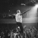 Macklemore Instagram - Nashville was our first stop of THE BEN TOUR USA. I’ve always loved this city. I have an outsiders infatuation with the hole in the wall hot chicken that is way too spicy for my digestive system, the rich lineage of country music that I’ve never listened to and the bars that I don’t drink at. It feels like the most beautiful time warp, an ode to an era of the past. It’s one of my favorite places in the world to go vintage hunting so I spent the day in pursuit of western relics, snakeskin garments and any other come ups the universe would provide. The southern charm is felt in every corner of this city and I felt such a genuine love and excitement from the fans I met before the show waiting in line. Being the first show of the tour I felt a bit nervous beforehand, which is a rare yet welcomed sensation for me these days. The historic, gorgeous and intimate Ryman auditorium is very different than the European festivals we’ve been playing the last 3 months. It’s almost like a different sport, going from massive crowds to intimate ones, but both equal in the opportunity to connect. The Nashville audience was perfectly engaged, turnt and some say they’ve never felt the floor shake like it did last night. Take that Bluegrass. It was extra special last night because my sister Kesha unexpectedly came through 30 seconds before we were about to play Good Old Days and in true Kesha form was down to just hop up on stage and do what she does best… Sing. To round out the Nashville experience after the show a handful of us went next door to the gem that is Roberts to hear the local band and struggle with what y’all call a 2 step. Shit still feels like a waltz count to me, and I eventually returned to the 2 step I learned in middle school to Jodeci. But I respect it. And I love Nashville. Thank you for setting off this tour in the best way possible. Next stop… Our nations capital. Ryman Auditorium Nashville TN