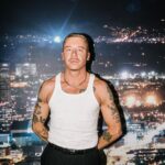 Macklemore Instagram - After a couple off days back in Seattle I landed in phoenix and was greeted by a sizzling 102 degree sun. I decided to dress up like a falcon wrangler. I met people outside that had been waiting since 9:30am to get in. We hugged, shed some tears and I felt really good in the spirit. The venue was air conditioned and dog friendly prolly. Just had that vibe that if you were a dog they’d let you chill in a hallway and give you a mini Mars bar or some shit. Anyway, I hit the stage in my falcon handling gloves and immediately felt restricted by the big tough leather covering my palms. After the first song they had to go. Bam! Threw them shits. The crowd was loose and nibble as was I, well hydrated and relatively sturdy. I was hitting a lot of spin moves to showcase how hydrated I actually was all while thinking in my head “You still got it my boy”. We laughed and some of my jokes hit. Some didn’t. Some people yawned. That always throws me off, so if you come to a show and you’re tired please hold that shit in. Anyway, the whole crowd was full of love and they sent us off stage with smiles and daps. Beautiful evening with the Cacti loving folks of Arizona. Next stop…LA for our finale show tonight.