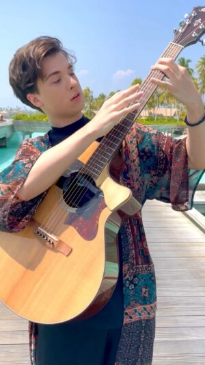 Marcin Patrzalek Instagram - Another unpublished one from the Maldives, not sure about the outfit tho 🧐 #guitar #maldives