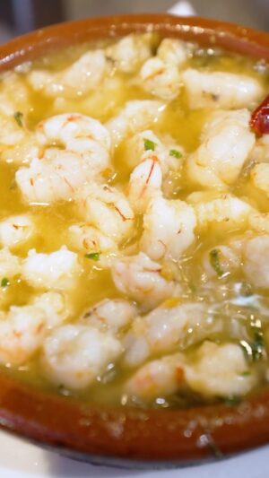 Mark Wiens Instagram - Sizzling garlic shrimp 🦐 @jamesblickspain Tapas in #Madrid #Spain!
