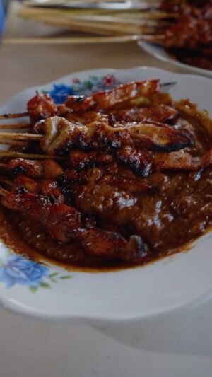 Mark Wiens Instagram - How does he do it all with one hand?? 🇮🇩 Indonesian chicken sate (satay), Madura style - one of the most popular in Indonesia 

📍 Sate Ayam Madura Pak Mat #Surabaya #Indonesia with @budi_tarjo