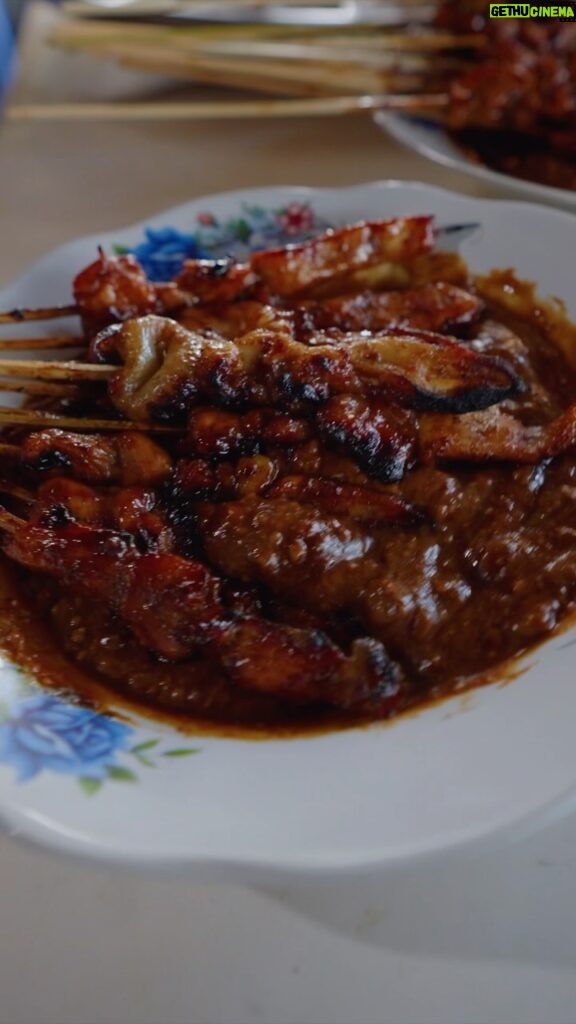 Mark Wiens Instagram - How does he do it all with one hand?? 🇮🇩 Indonesian chicken sate (satay), Madura style - one of the most popular in Indonesia 📍 Sate Ayam Madura Pak Mat #Surabaya #Indonesia with @budi_tarjo Surabaya, Indonesia