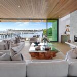 Mary Fitzgerald Instagram – Just Listed – 2201 Bayside Dr. – $27,995,000

5 Beds / 9 Baths / 9,129 Sq. Ft. / 11,921 Lot Size

This newly constructed custom estate offers exclusive Corona Del Mar waterfront living with intricate design touches and a harmonious blend of natural stone and wood elements. Consisting of 5 ensuite bedrooms and 9 bathrooms and boasting approximately 50 feet of private beachfront, it caters to water enthusiasts and offers shared ownership of one of the longest private docks on the west coast, capable of accommodating multiple yachts up to 100ft in length. Upon arrival, you will be greeted by meticulously landscaped surroundings, a striking grand pivot door, and a double height foyer that sets the tone for the residence. Inside, the space boasts European wide plank bleached oak flooring by Gaetano, illuminated floating staircases, and expansive glass features that fill the approximately 9,129 square feet of interiors with an abundance of natural light. The property seamlessly connects to its surroundings through slide-away pocket doors that open onto a heated patio, a zero-edge saltwater pool and spa, and a courtyard featuring a built-in Lynx Grill. The kitchen features custom Honed Calcatta Vagli slab countertops and backsplash, a 55″ La Canche designer stove imported from Paris, a butler’s pantry, and stained white oak cabinetry. Convenience is paramount, with a Waupaca elevator servicing all four floors, including the lower level, which encompasses a media area, a dry bar, and temperature controlled wine room. Upstairs, the owner’s suite presents a heated wraparound balcony with mesmerizing water views, a living space with a fireplace, and two spa-like bathrooms, each complemented by its own walk-in closet. The top level reveals a lounge area that opens onto a rooftop deck with grass and sweeping views of the Newport Beach Harbor offering limitless ocean-view entertaining. Equipped with cutting-edge technology, the property also includes a nearly 3,000 sq. ft., 6+ car garage with epoxy flooring.

Listed by @briancharlesfurstenfeld @mskaylacardona @jasonoppenheim 

#theoppenheimgroup #realestate #luxurylifestyle #fyp #newlisting