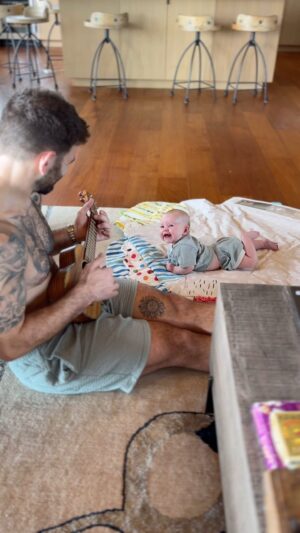 Mat Fraser Instagram - Morning routine. Learning to play the ukulele while in Hawaii seems fitting and Eddy loves it. This is the phase of life where I’ll do anything for those smiles. #girldad #ukulele