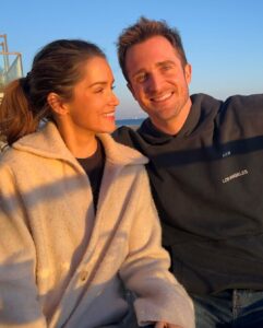 Matthew Hussey Instagram - This first picture was taken the night Audrey and I met! How crazy is it that we have a picture from the night we met! A friend of Audrey’s randomly took the photo of us, and then sent us the photo 2 years later when they found it on their phone and realized we had become serious! We’d literally met for the first time an hour before this picture was taken. Just two lil babies flirtin’. I wasn’t even going to go to this party. I just happened to be back in London for Christmas that week and a friend of mine persuaded me to go. When we were on the way, that same friend told me: “There is a girl who will be there that all the boys are in love with, and we’re all afraid you’re going to steal her”. He didn’t tell me who it was when we walked in, but within minutes I knew. I was glued to the tv in the bar at the beginning of the evening because there was this big boxing match on that night, but I kept making eye contact with her the whole time. She sidled up next to me, started watching the tv, and then asked me a question about the boxing (something she has never shown an interest in since). And that was that. We talked for 8 hours that night (literally). David Brookes once said: “A marriage is a 50 year conversation. Have I met a person who I can talk to for that length of time?” I have, which is why I asked this incredible human being to marry me. I can’t believe I get to build a life with someone as amazing as you. I’m stupidly excited to do it all with you—to be grown ups and do all the grown up things, while deep down staying just two lil babies flirtin’. Happy Valentine’s Day @theaudreyhussey. I love you forever. ❤️