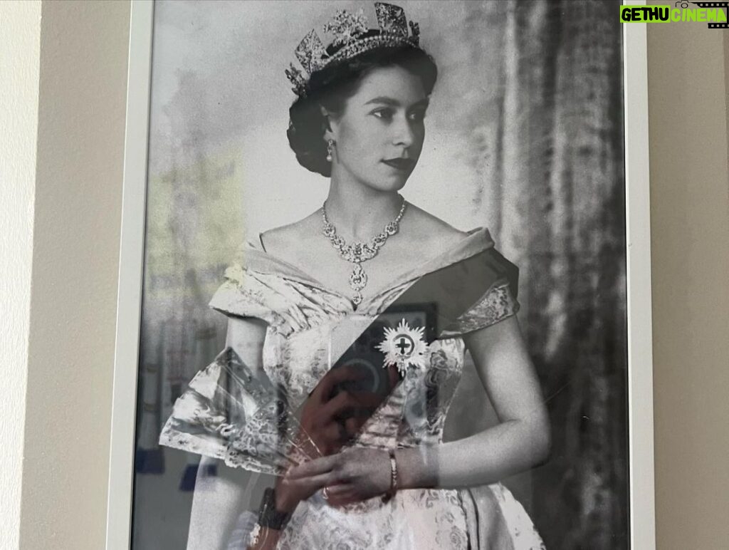 Matthew Lewis Instagram - This was as close as I ever got to Her Majesty. I, along with a few of the old gang, were invited to sit with her at the palace while we watched a little film we made for her 80th birthday. I think she liked it. Quite an honour for a northern monkey sporting a black eye, let me tell you. The second image is a picture hanging in my office because I’m a weirdo. Truth be told, anyone who knows me, knows me to be a contradiction. Everything about me screams republican (small-r, not the dreadful elephant kind). I think monarchy is mad, in this or any century. Even writing this all seems, frankly, a bit silly. And yet… and yet. For better or worse, so much of my identity is wrapped up in it, has always been. More so living abroad these last few years, and with all the “leaders” the UK has been burdened with, HM was a constant, part of an intangible sense (illusion?) of stability. I can’t think of much else to say, nor why I even felt compelled to say anything at all but I guess, after a lifetime of service to her country, I hope that she may now rest in peace. GSTK.