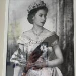 Matthew Lewis Instagram - This was as close as I ever got to Her Majesty. I, along with a few of the old gang, were invited to sit with her at the palace while we watched a little film we made for her 80th birthday. I think she liked it. Quite an honour for a northern monkey sporting a black eye, let me tell you. The second image is a picture hanging in my office because I’m a weirdo. Truth be told, anyone who knows me, knows me to be a contradiction. Everything about me screams republican (small-r, not the dreadful elephant kind). I think monarchy is mad, in this or any century. Even writing this all seems, frankly, a bit silly. And yet… and yet. For better or worse, so much of my identity is wrapped up in it, has always been. More so living abroad these last few years, and with all the “leaders” the UK has been burdened with, HM was a constant, part of an intangible sense (illusion?) of stability. I can’t think of much else to say, nor why I even felt compelled to say anything at all but I guess, after a lifetime of service to her country, I hope that she may now rest in peace. GSTK.