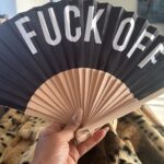 Mel B Instagram - When your friend knows your vibe so well, they gift you the ultimate ‘express yourself’ accessory. 🖤🤘 Thanks to the fabulous @joancollinsdbe for this bold statement piece - because sometimes a ‘fuck off’ fan speaks louder than words! 😂✨ #GiftGoals #JoanCollinsApproved