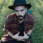 Michael Malarkey Instagram – My new song ‘The Passenger’ is OUT TODAY!

This is the first single from my forthcoming EP out April 4th and features my pal @rasha_nahas 🖤

Stream it everywhere now. Share it with your friends. Free Palestine. 

More news soon…

📷 @raym.jones

LYRICS

don’t turn away
‘cos anything can happen 
a tidal wave
or something less ordinary 
be not afraid
‘cos anything can happen 
something unfamiliar 
anything can happen 
don’t turn away

we’re comin down
so don’t take your coat off 
be always ready to leave 
if you’re comin over
don’t take your boots off 
be always ready to leave
no hangin ‘round the ceiling 
paper trails cover me
it’s more than just a feeling 
always ready to leave
they cut us up like roses
and something feels so wrong
and something feels so hollow
get your eyes back on the road again 

cos anything can happen
don’t turn away
anything can happen

no one needs to know
who caused the accident
it seems so futile to cast the blame again 
the time it takes 
to fill in the blanks like that
passenger seat, gunnin for ya

we fall into future tense

always ready to leave
no hangin ‘round the ceiling 
paper trails cover me
it’s more than just a feeling 
always ready to leave
they cut us up like roses
and something feels so wrong 
and something feels so hollow

we fall into future tense
get your eyes back on the road again