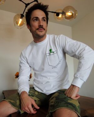 Michael Trevino Instagram - Thinking about the crew of @cwroswellnm and wondering when we’ll all be back together working on season 3. Given the world’s current situation @cadlymack and the cast have started a fund to keep our crew afloat as industry jobs are put on hold. If you’d like to purchase this super sweet long sleeve I’m wearing hit the link in my bio where you’ll find all kinds of merchandise. 100% of proceeds from sales of these shirts go to A Little Alien, a 501(c)(3) nonprofit set up to ease financial hardship inflicted on our beloved crew by the Covid-19 crisis. Be safe everyone. Thank You!