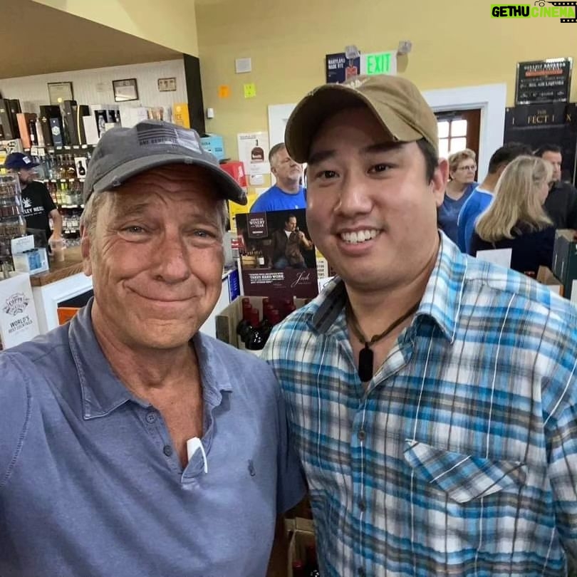 Mike Rowe Instagram - Sunday, outside of @BelAirLiquors there was thunder and lightning and an inch of rain falling every 30 minutes. Inside, there were over 100 well-mannered people with excellent taste in whiskey, waiting patiently in line to shake my hand and grab a photo. What do you say to people who brave a hurricane to say hello and buy a signed bottle of your grandfather’s whiskey? Well, if you’re me, you say “thanks,” as sincerely as you can, over and over again. Among others was the Pelletier family, all 14 of them. This is the largest family I’ve ever posed for a photo with, and I’m not even sure they were all represented. Once you show up with 14, you have to assume there’s another 3 or 4 in the wings, right? I don’t remember each of their names, but I think it was young Jake (?) who made a crab out of stones, mounted it in a very tasteful frame, and presented it to me as a gift. Thanks, Jake. Very thoughtful. I’ll hang it in a place of prominence upon my return. I met Nick Berte, who built a very cool Double Whiskey Barrel Liquor Cabinet, that opens and closes with the touch of a remote control. The store is raffling it off at the annual Maryland Italian Festival to raise money for charity. I met Mike Griffith, who is a Maryland State Delegate for District 35B. I know this because he gave me his business card, which I I’ll hang on to. You never know when you need the services of a state delegate, right? And then there was Jon, a Baltimore County Detective who was shot four times by a creep with an AR-15 just a few months ago. Jon survived, happily, and was released from the hospital not long ago. His wounds are very serious, but he stood in line like all the others, thanked me for supporting first responders, and gave me a patch that said, “Don’t Die Easy.” What do you say to a guy who risks his life to serve and protect you, gets damn near killed, and then comes out on a rainy Sunday to shake your hand? If you’re me, you say “thanks,” as sincerely as you can, over and over again. I proprietor, Larry Dean, and his hardworking family. Big thanks to all of you guys, for making it happen. And congratulations for having such awesome customers. Till next time. Belair Md