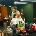 Mike Rowe Instagram - I was in Zurich yesterday, window shopping, when I noticed my reflection in the glass, and concluded a haircut was in order. The closest place was called Finest Barbers, and I was curious to see if the establishment lived up to its name. My barber was Sammy, from Turkey. He told me he’d been cutting hair for ten years. After Sammy finished with my haircut, which was excellent, by the way, I went to Angel’s chair, and had a memorable chat about work ethic, entrepreneurship, and the value of mastering a skill that’s in demand. As we chatted, Angel dipped some Q-Tips into a fondue pot filled with hot wax. The wax was black for some reason – like the pitch they apply to ropes on the tall ships, to keep them from fraying. As we chatted, Angel inserted the black Q-Tips into my nostrils, and waited for the wax to harden. “Is this a service you include with all haircuts,” I asked. “No,” said Angel. “This is an additional $15 francs. “But not for you, my friend. This one is on the house.” “You’re too kind,” I said. “Don’t mention it,” said Angel. After a minute or two, the wax was sufficiently hard, and the suspense was sufficiently built. “Just relax,” Angel told me. “I’ll count down from three.” I tried to relax. Angel said, “Three…” and quickly ripped the Q-Tips from my nostrils. I screamed, and maybe peed a little. If you find yourself in Zurich and in need of a trim, please tell the Finest Barbers that the dirty jobs guy sends his regards. And if you go with the internal nose wax, you’ll find the Swiss air even more bracing and more invigorating than before...