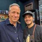 Mike Rowe Instagram - I was in Zurich yesterday, window shopping, when I noticed my reflection in the glass, and concluded a haircut was in order. The closest place was called Finest Barbers, and I was curious to see if the establishment lived up to its name. My barber was Sammy, from Turkey. He told me he’d been cutting hair for ten years. After Sammy finished with my haircut, which was excellent, by the way, I went to Angel’s chair, and had a memorable chat about work ethic, entrepreneurship, and the value of mastering a skill that’s in demand. As we chatted, Angel dipped some Q-Tips into a fondue pot filled with hot wax. The wax was black for some reason – like the pitch they apply to ropes on the tall ships, to keep them from fraying. As we chatted, Angel inserted the black Q-Tips into my nostrils, and waited for the wax to harden. “Is this a service you include with all haircuts,” I asked. “No,” said Angel. “This is an additional $15 francs. “But not for you, my friend. This one is on the house.” “You’re too kind,” I said. “Don’t mention it,” said Angel. After a minute or two, the wax was sufficiently hard, and the suspense was sufficiently built. “Just relax,” Angel told me. “I’ll count down from three.” I tried to relax. Angel said, “Three…” and quickly ripped the Q-Tips from my nostrils. I screamed, and maybe peed a little. If you find yourself in Zurich and in need of a trim, please tell the Finest Barbers that the dirty jobs guy sends his regards. And if you go with the internal nose wax, you’ll find the Swiss air even more bracing and more invigorating than before...