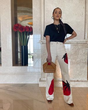 Nathalie Emmanuel Instagram - 🍓🍓🍓

My look for second day @mefcc in Abu Dhabi! 

Styling: @chercoulter
Jeans and bag: @jw_anderson
Tshirt: @sunspelclothing
Jewellery: @missoma, @mejuri and @mathe_jewelry 
Shoes: @aldo_shoes
Sunglasses: @akonieyewear
Nose ring: @laura_bond_jewellery