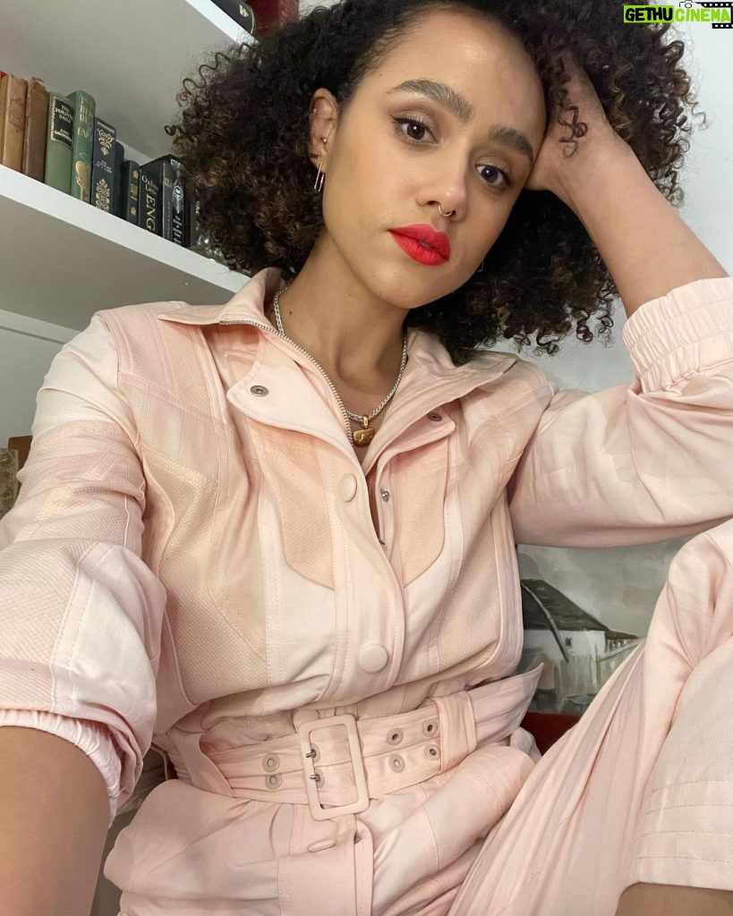 Nathalie Emmanuel Instagram - Virtual press day last week, despite being from my living room, required this fabulous powder pink boiler suit by one of my faves @stellamccartney.. @alighieri_jewellery necklace and @otiumberg earrings… all styled by @chercoulter Glam by me