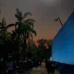 Nathan Fillion Instagram - I call this photo, “TDK by Moonlight on the Beach”. Only it’s not a beach, it’s a set. And it’s not the moon, it’s a giant light on the top of a crane. And I have no idea whether I’m wearing pants in this photo. #suicidesquad #jamesgunn #moviemoon #somethinginmyeye