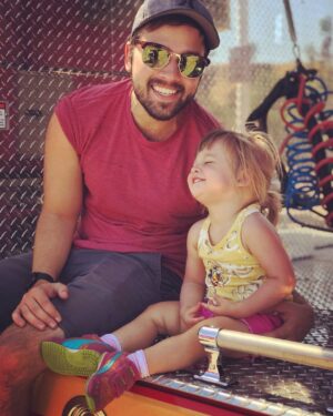 Nathan Kress Instagram - My Dearest Rosie, 
You are 2 years old. How did this happen? Where is time going? I can't believe the person you have become over this past year. You are a walking (sorry, sprinting), talking, singing, POWERHOUSE of a human being. You are impossibly energetic, as spirited as the day is long, and your infectious personality charms every single person you meet. You still never stop moving, exploring, observing, absorbing. The world is just not enough. You live voraciously... ravenous for adventure, and danger. You are literally fearless. Like, it's becoming a problem sometimes. You are a giant ham, just like your daddy. Holy moly, do you love Christmas lights. You yell "HALLELUJAH!!!!" whenever we walk through church, and no one taught you to do that, so I'm convinced you might be half angel. You keep getting more beautiful, and I'm starting to get freaked out. You were never much of a cuddler as a baby, but you're just barely beginning to stop squirming when we hug you, and we are HERE FOR IT. This had been a hard year for our little family. Tough stuff happened. We've all done a lot of growing up. You especially! Your strong will and determination have been on full display as you continually recite your favorite word: "no". You're learning so much about boundaries, patience, manners, right and wrong. It's a lot!! You get frustrated. That's okay. That's part of it. In the midst of it all, you have displayed understanding and comprehension beyond your years. It's truly inspiring. But my favorite thing that you have developed this year, my love, is your heart. You have a seemingly endless supply of compassion and empathy for the world around you. You feel things with such authenticity and depth. Trash on the ground breaks your heart. A Pixar character in danger makes you cry out in worry, and your sigh of relief when they're safe again makes me melt. I believe your social and emotional awareness will be one of your greatest assets as you go out into the world. That, coupled with your courage, your fortitude, and your unbridled energy, will make you a world-changer. I'm sure of it. 2 years in, you sure have changed ours for the better. We love you, dear one.