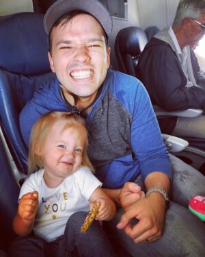Nathan Kress Instagram - My Dearest Rosie, 
You are 2 years old. How did this happen? Where is time going? I can't believe the person you have become over this past year. You are a walking (sorry, sprinting), talking, singing, POWERHOUSE of a human being. You are impossibly energetic, as spirited as the day is long, and your infectious personality charms every single person you meet. You still never stop moving, exploring, observing, absorbing. The world is just not enough. You live voraciously... ravenous for adventure, and danger. You are literally fearless. Like, it's becoming a problem sometimes. You are a giant ham, just like your daddy. Holy moly, do you love Christmas lights. You yell "HALLELUJAH!!!!" whenever we walk through church, and no one taught you to do that, so I'm convinced you might be half angel. You keep getting more beautiful, and I'm starting to get freaked out. You were never much of a cuddler as a baby, but you're just barely beginning to stop squirming when we hug you, and we are HERE FOR IT. This had been a hard year for our little family. Tough stuff happened. We've all done a lot of growing up. You especially! Your strong will and determination have been on full display as you continually recite your favorite word: "no". You're learning so much about boundaries, patience, manners, right and wrong. It's a lot!! You get frustrated. That's okay. That's part of it. In the midst of it all, you have displayed understanding and comprehension beyond your years. It's truly inspiring. But my favorite thing that you have developed this year, my love, is your heart. You have a seemingly endless supply of compassion and empathy for the world around you. You feel things with such authenticity and depth. Trash on the ground breaks your heart. A Pixar character in danger makes you cry out in worry, and your sigh of relief when they're safe again makes me melt. I believe your social and emotional awareness will be one of your greatest assets as you go out into the world. That, coupled with your courage, your fortitude, and your unbridled energy, will make you a world-changer. I'm sure of it. 2 years in, you sure have changed ours for the better. We love you, dear one.