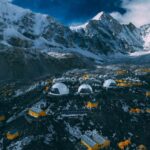 Nirmal Purja Instagram - Everest Base Camp might be home away from home for our Elite Exped team, but what is life here really like? The Base Camp is found at the bottom of the Khumbu Glacier, it is surrounded by the beautiful peaks of the region. We invest in our camp to make sure it is the best experience for our adventurers, with great coffee, a fully stocked kitchen tent and food, and showers, power and electricity. While we take our set up seriously, we also take our responsibility to the environment just as seriously. We follow all environmental protocols, including leave no trace and clean as you go. Our Base Camp is powered by a solar array that supplies all the energy we need. We have a back-up generator in case the weather turns bad – but in general we rely on solar power. Base Camp is a place where our adventurers spend time to rest, acclimatise and prep for their climbs and acclimatisation routines (*or just rest before trekking back to Kathmandu.) Want to join us? We have Everest Base Camp treks going this autumn on: Sept 11th and 5th and 7th of November. Or why not beat the rush and join us in Spring 2024? ✉️Info@eliteexped.com Copyright: @nimsdai  📸 @josemostajo #eliteexped #nimsdai #14peaks #14peaksnothingisimpossible #achieveyournewpossible  #nothingisimpossible #nims #nimspurja #14peaks6months #beyondpossible #k2winter #k2firstascentnoo2 #uksf #club8000ers #everest #k2 #k2winter #aboveandbeyondadventure #alwaysalittlehigher #nimsdaifoundation #bigmountaincleanup #nimsdaistore #nimsdaiultimatesummitsuit Mount Everest Base Camp