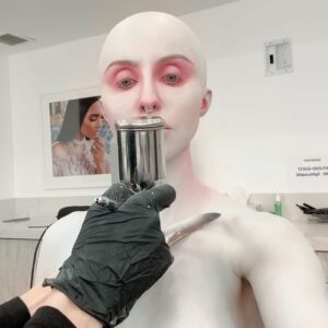 Norvina Instagram - Ai created my Halloween look. I love Midjourney and I wanted to see what look it would come up with for me. It’s felt perfectly complicated and I instantly loved it. 

Thanks for putting this together with me @nellyrecchia and @yvonneboyiazis for bald cap and 3D printing 😘

I went to Cinema Makeup School where she teaches and was scanned to create the exact pieces with their 3D printer. 

You’ll see a photo of the actual chest piece being molded by the printer. It’s so freaky and awesome.

The only thing we left out are the details in the Ai beings face, didn’t really make sense for me so I left that out. Had a great time bringing to life Ai generated art