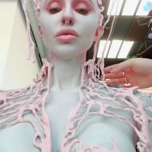 Norvina Instagram - Ai created my Halloween look. I love Midjourney and I wanted to see what look it would come up with for me. It’s felt perfectly complicated and I instantly loved it. 

Thanks for putting this together with me @nellyrecchia and @yvonneboyiazis for bald cap and 3D printing 😘

I went to Cinema Makeup School where she teaches and was scanned to create the exact pieces with their 3D printer. 

You’ll see a photo of the actual chest piece being molded by the printer. It’s so freaky and awesome.

The only thing we left out are the details in the Ai beings face, didn’t really make sense for me so I left that out. Had a great time bringing to life Ai generated art