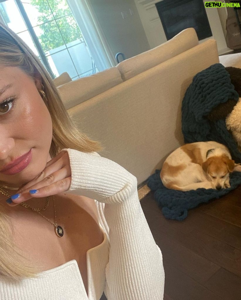 Olivia Holt Instagram - happy #internationaldogday to my lil chicken. i love you more than you love naps and blankets 🥲