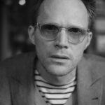 Paul Bettany Instagram - @robotproof took this photo one hundred years ago. I look very concerned but I was actually just trying to read the lens speed on his camera.