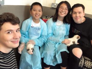 Phil Lester Instagram - Got to pet these tiny puppies today so it’s all downhill from here. Thanks to @rachael__pie (and her bro) for hanging out with us and @makeawishuk and @battersea for making it happen!

Swipe to the next pic for some extreme puppy dog eyes 🐶