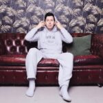 Phil Lester Instagram - 🍂Cosy season activated🛋 New merch the COUCH CLUB set is out now!! Ultimate fluffy comfortable loungewear perfect for a soft day chilling on the couch - featuring a cloud-like hoodie/bottoms set and super snuggly socks ☁️☁️☁️ Available now on my shop: amazingphilshop.com (worldwide) or us.amazingphilshop.com (USA) 📸 @lindablacker