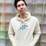 Phil Lester Instagram - ✨🍃Imagine a peaceful future without humans, just a cyber-Phil vibing with the flowers in Spring 2121 🤖🌷 A new limited merch collab with one of my favourite artists @deathandmilk_ !! Off-white soft hoodie in a double sided futuristic floral print - only available until the end of May Worldwide: amazingphilshop.com USA: us.amazingphilshop.com