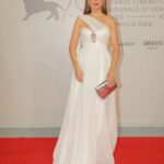 Raya Abirached Instagram - Dressed in white 🤍 for the back to back premieres of 2 very special movies, #Argentina1985 produced by my great friend @axelkuschevatzk & #Nezouh, starring the awesome @kindaalloush & @sameralmasri at the #VeniceFilmFestival @labiennale #StyledbyCed @cedrichaddad Jewellery: @bulgari Dress: @zuhairmuradofficial Make-up: @alessandranuovavia for @charlottetilbury , @charlottetilburyarabia Clutch & shoes @jimmychoo Photos @santinagargiulo Venice Film Festival
