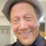 Rob Schneider Instagram – Part 1.
I want thank ALL of you LOVELY people for their kind birthday wishes for me today on my 60th birthday.
I am the luckiest man in the world.
I have a wonderful partner in life, my beautiful wife Patricia and three lovely daughters; Elle, Miranda and Madeline and my grandson Lucky!!
Today, I am reminded of what Dr. M Scott Peck told me over 30 years ago: At 40, you feel like you can conquer the world and there’s a sense that nothing can stop you.
But at 60 you realize the very real fragility of life and temporariness of it all. A humbling knowledge that there is indeed a time limit for all things and that God’s design though perfect, is precious far beyond its brevity.
Today, I am also reminded of the Hindu story that my friend Bill from Lowell Arkansas told me about a man at his funeral. Looking at the man, “Would this man lying here ask for more riches and Gold from the world? Would this man ask to be more famous and well regarded by others? Would he ask to be taller or look more handsome? No. The only thing this man lying here today would ask for was much simpler…more time.”
If you are reading this now, then you too have time! Use it wisely, use it unwisely too! But USE it. Be IN it. Be aware that you are part of ALL of it and that the separateness you sometimes feel is an illusion. Just as your heart beats without being told, you are as integral to the Sun that fires and the planets that circle it as your heart is a part of you.
For the atheists, God loves you too. The mistake you make is to think the universe is a stupid thing that just bumps into things and expands ignorantly and without reason or intelligence.
And that somehow we human beings, with our intelligence is just some kind of ‘freak’ universal accident.
To you I say this, if there is such a thing as kindness, empathy, compassion and love…it is because you found it in other people. And as my dear friend Norm Macdonald once said, we are part of this universe, indeed a mere fraction of it, so if we have kindness and love, how much more the universe itself.”
For if we are capable of love, it is because it is endemic to the universe itself.