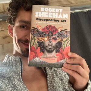 Robert Sheehan Instagram - Ladies and Gentleladies (and emus), my shiny new book. #DisappearingAct - It exists. In print. Ooooooh and it feels so good to hold it in my hand. All of yous can too when it’s released on Oct 22nd 🌎 - preorder links in bio, and the first 1,000 copies sold by @eason_ireland get a special signed print (by me). Thank you luv you bye 😘