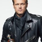 Sam Heughan Instagram - Warming up to Spring…. with @sassenachspirits ☀️🌧️ (Our 100% wool, Scottish artisan hybrid weave scarves are back in stock!) #Sassenach #Tartan