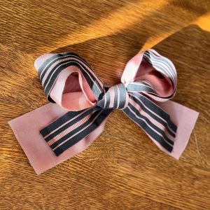 Sarah Jessica Parker Instagram - The bow that started it all.
When I saw how madly in love everyone was with this bow (as was I), a last minute detail thrown together by me and @sergenormant just minutes before leaving for the annual @nycballet Fall Gala, I immediately set out on a mission: searching for and sourcing the finest grosgrain, taffeta and satin ribbons. In many cases the vintage I was hoping still existed and could unearth. 
From hidden corners of New York City, to unique and interesting places far far away, I've found some really special and insanely beautiful ones.
And with that, I introduce you to: the @sjpcollection Gala Bow.
From Petite to Grand in length, I hand picked every single ribbon - some almost 100 years old! - and crafted a collection that I’m quite proud of.
Our Gala Bows come with a sturdy 3-inch flat hair pin making it easy to affix however your heart desires.
Most importantly, each bow was sewed with love. And you can be assured that I’ll be personally steaming, boxing up, and shipping out every single Gala Bow order that comes in.
I can’t wait to see how you wear these.
Link to shop is in my bio.
X, SJ
PS. For those concerned, that bow is simply rested on Lotus. Not tied!