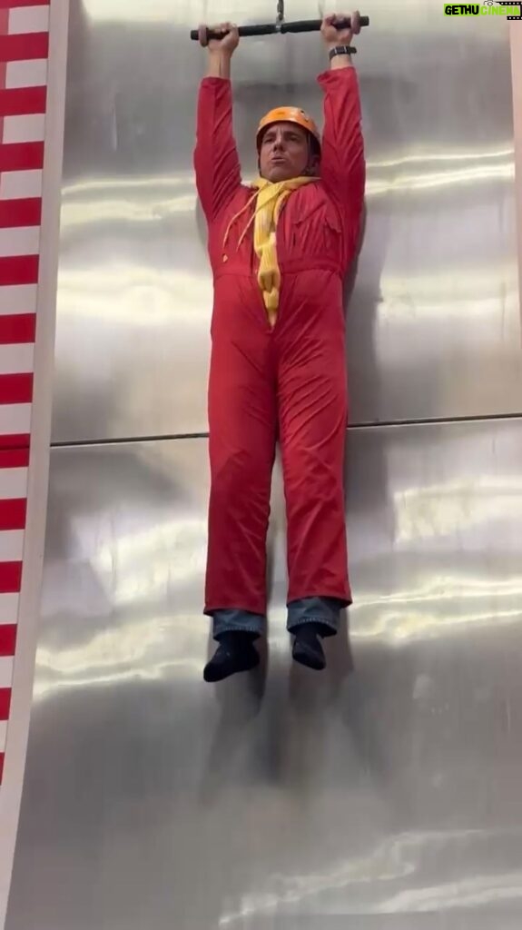 Sebastian Maniscalco Instagram - There’s a lot happening in this video. Firstly, the red jumpsuit is too small. Secondly, I’m way too afraid for a slide, and I think I will do just about anything for my kids.