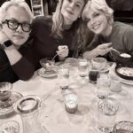 Selma Blair Instagram - 🤍🗽 Image Descriptions: 1. Selma has short blonde hair and is sitting on brick balcony wearing a grey coat with black collar. 2. Black/white photo of Selma and Christian Siriano at dinner. Christian has short dark hair and is wearing a black tshirt. 3. Selma is wearing a black sweater and sunglasses. A man is seated behind her playing with her dog Scout. 4. Black/white photo of Selma, Art Tavee and Carolyn Griffin at dinner. Art has short light hair and wears glasses and Carolyn has shoulder length hair. 5. Selma, Troy, Art, and Carolyn posing together for a selfie outside at dinner. 6. Selma posing in the mirror in a hotel bathroom. There are pink flowers in the focus of the photo. She wears a black sweater with a white collared shirt under it. New York, New York