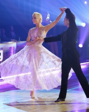 Selma Blair Instagram - My final waltz. Girlhood dreams realized. And making new friends in all of you is my honor. And I hold you all dear. Forever. From the first week to the last.♥️ @dancingwiththestars @disneyplus 

Image one: Selma has short blonde hair and is wearing a long pink dress while holding a cane in her left hand and being lifted and held in the air. 

Image two: Selma and Sasha are dancing on stage while Selma’s pink dress twirls.

Image three: Jessie James Decker has long brown hair and is smiling while standing behind Selma to her left.

Image four: Gabby Whitney has long brown hair and is smiling while standing next Selma to her left.

Image five: Selma stands on the left with her arm around Joseph Baena whole is smiling and wearing a white tank top.

Image six: Jordin Sparks is on the left wearing a white dress and smiling. Emma Slater, standing in the middle, has long blonde hair and is smiling. Selma is standing on the right smiling.

Image seven: Carrie Ann Inaba stands on stage on the left with her hair up and parted in the middle while Selma is on the right.

Image eight: Arthur is a standing on the left in a white shirt and has short brown hair. Ruby Rose also has short brown hair and is standing in the middle with her arms around Arthur and Selma.

Image nine: Selma has slicked back short blonde hair and is standing on the left in a pink dress. Shangela is on the right wearing a purple dress with her short dark hair styled with waves. 

Image ten: Photo of the cast on stage taken from balcony. Selma stands in the middle wearing a long pink dress.