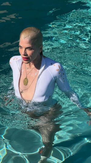 Selma Blair Instagram - Mad about you 💋

[Video Description: Selma has bleached blonde hair and is wearing a white bathing suit while in and around a pool with her dog Scout.]
