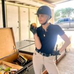 Selma Blair Instagram - Welcome to my Lonely fans 🦮🎠 Video Description: Selma with short blonde hair, wearing a white riding top and tan pants, rides in her car. She visits the stables to see her white horse, Mr Nibbles, and rides on horseback around the arena. Scout her brown dog is with her and sits on her lap.