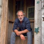 Steven Ogg Instagram - Squeezing it out during a lunch break on location. Pinching off some poetry read. One take. One attempt. Many chipmunks. “He loved her and she loved him. His kisses sucked out her whole past and future or tried to He had no other appetite She bit him she gnawed him she sucked She wanted him complete inside her Safe and sure forever and ever Their little cries fluttered into the curtains Her eyes wanted nothing to get away Her looks nailed down his hands his wrists his elbows He gripped her hard so that life Should not drag her from that moment He wanted all future to cease He wanted to topple with his arms round her … In their entwined sleep they exchanged arms and legs In their dreams their brains took each other hostage In the morning they wore each other’s face” (I incorrectly said faces….it happens…apologies!) 🎶Music to accompany- @danmanganmusic new single “YOU KNOW IT.”🎶 #poetry #outhouse #DropOneOff #tedhughes Outhouse