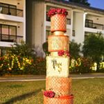 Swasika Instagram - 8 tier Royal wonder for Swasika’s wedding reception When Swasika contacted me 4 months before her wedding, I had no idea that I would be making something like this for her. All she wanted was something Red, Elegant & Royal. And from there the discussions started and ended with this 8 tier beauty! The look on Swasika’s face when she saw her cake was worth all the effort I put into it… The entire cake was covered in fondant. The red colour was particularly customised and hand rolled to suit her liking. The beige square tier was a last minute addition inspired by her wedding saree blouse. Each tier was meticulously stencilled with Royal icing and hand painted gold. I added fondant accents to enhance the overall look. The entire look was completed with a custom acrylic topper that included the bride and groom’s initials and some flowers . . The cake design was inspired by @indulgencebyshazneenali and @cakestrybyfathimaiqbal wedding cakes RECCAA Club