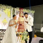 Swasika Instagram - 8 tier Royal wonder for Swasika’s wedding reception When Swasika contacted me 4 months before her wedding, I had no idea that I would be making something like this for her. All she wanted was something Red, Elegant & Royal. And from there the discussions started and ended with this 8 tier beauty! The look on Swasika’s face when she saw her cake was worth all the effort I put into it… The entire cake was covered in fondant. The red colour was particularly customised and hand rolled to suit her liking. The beige square tier was a last minute addition inspired by her wedding saree blouse. Each tier was meticulously stencilled with Royal icing and hand painted gold. I added fondant accents to enhance the overall look. The entire look was completed with a custom acrylic topper that included the bride and groom’s initials and some flowers . . The cake design was inspired by @indulgencebyshazneenali and @cakestrybyfathimaiqbal wedding cakes RECCAA Club