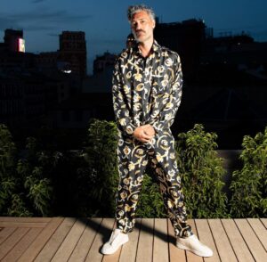 Taika Waititi Instagram - Followed this chick around Madrid while she sang in a palace for @cartier. Thank you, Universe, for this sweet life and also thank you @nanushka for the silkies. damn your clothes are nice. 
Stylez: @jeanneyangstyle 
📸: @tiziano.raw