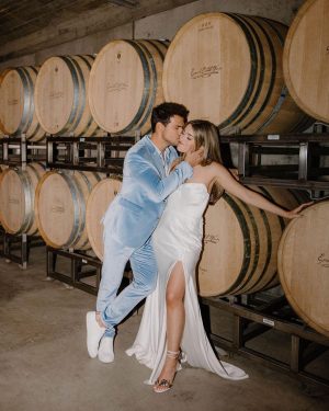 Taylor Lautner Instagram - WELCOME PARTY
Following rehearsal dinner, doors opened to the rest of the underground wine caves where we held a party to welcome all of our guests to Paso Robles for the weekend. Two black wooden bars, grey stoneware plates, charcoal tufted couches and loveseats, and gorgeous concrete and wooden starburst cocktail tables were additional details which enhanced the existing environment, and played into the underground winery aesthetic. We are true foodies at heart so we wanted to give guests an assortment of options to indulge in. This included 4 different food stations to satisfy every palate. A Mezze station, oyster and seafood bar, Tapas station and an Americana station. Our personal favorite was the chef carved Jamoń Iberico and chef manned raclette cheese melter. Complimenting the delicious food of course was Epoch’s killer wines. It truly was the most unique environment and best way to welcome all of our family and friends to a place that holds such a special spot in our hearts. 
Let the festivities begin! 

Planning and Event Design @samkoma.world 
Venue @epochwines 
Photography @nicoleivanovphoto 
Lighting @tn_event_designs