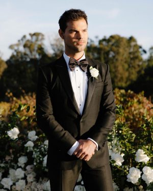 Taylor Lautner Instagram - CEREMONY
The ceremony was something we’ve been dreaming of for a long time. Along with the help of our wedding planners, we put in a lot of thought designing what exactly we wanted for this monumental moment and it came together even better than we had imagined. The ceremony location was at one of the highest points on the Epoch property which overlooks miles of wine country in Paso Robles. The colors surrounding us at this time of year are exactly why we love the Fall season so much. In an effort to provide shade and intimacy we installed a wooden truss system and semi sheer white draping, to create a relaxing and partially shaded ceremony location. White florals and lush greenery trailed up the columns of the wooden
structure and down the ceremony aisle. Beautiful white floral blooms surrounded us on a circle riser stage. As guests arrived by shuttle, they were invited to take a walk through the vineyard to the ceremony site. Our pastor and dear friend Judah Smith officiated the ceremony. It couldn’t have been more perfect. We exchanged hand written vows in front of the people we love most. Looking around and seeing the faces of each and every single person there, really put into perspective what is most important in life. Love. The sun set just as we said our “I Do’s” and the most beautiful pink sky was our backdrop as we walked back down the aisle as Mr. and Mrs. Taylor Lautner for the first time. 

Planning and Event Design @samkoma.world
Venue @epochwines
Photography @nicoleivanovphoto
Lighting @tn_event_designs
Floral Design @noonansdesigns 
Wedding Dress @winniecouture 
Grooms Tux @dolcegabbana