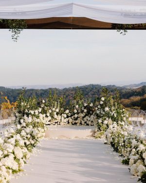 Taylor Lautner Instagram - CEREMONY
The ceremony was something we’ve been dreaming of for a long time. Along with the help of our wedding planners, we put in a lot of thought designing what exactly we wanted for this monumental moment and it came together even better than we had imagined. The ceremony location was at one of the highest points on the Epoch property which overlooks miles of wine country in Paso Robles. The colors surrounding us at this time of year are exactly why we love the Fall season so much. In an effort to provide shade and intimacy we installed a wooden truss system and semi sheer white draping, to create a relaxing and partially shaded ceremony location. White florals and lush greenery trailed up the columns of the wooden
structure and down the ceremony aisle. Beautiful white floral blooms surrounded us on a circle riser stage. As guests arrived by shuttle, they were invited to take a walk through the vineyard to the ceremony site. Our pastor and dear friend Judah Smith officiated the ceremony. It couldn’t have been more perfect. We exchanged hand written vows in front of the people we love most. Looking around and seeing the faces of each and every single person there, really put into perspective what is most important in life. Love. The sun set just as we said our “I Do’s” and the most beautiful pink sky was our backdrop as we walked back down the aisle as Mr. and Mrs. Taylor Lautner for the first time. 

Planning and Event Design @samkoma.world
Venue @epochwines
Photography @nicoleivanovphoto
Lighting @tn_event_designs
Floral Design @noonansdesigns 
Wedding Dress @winniecouture 
Grooms Tux @dolcegabbana